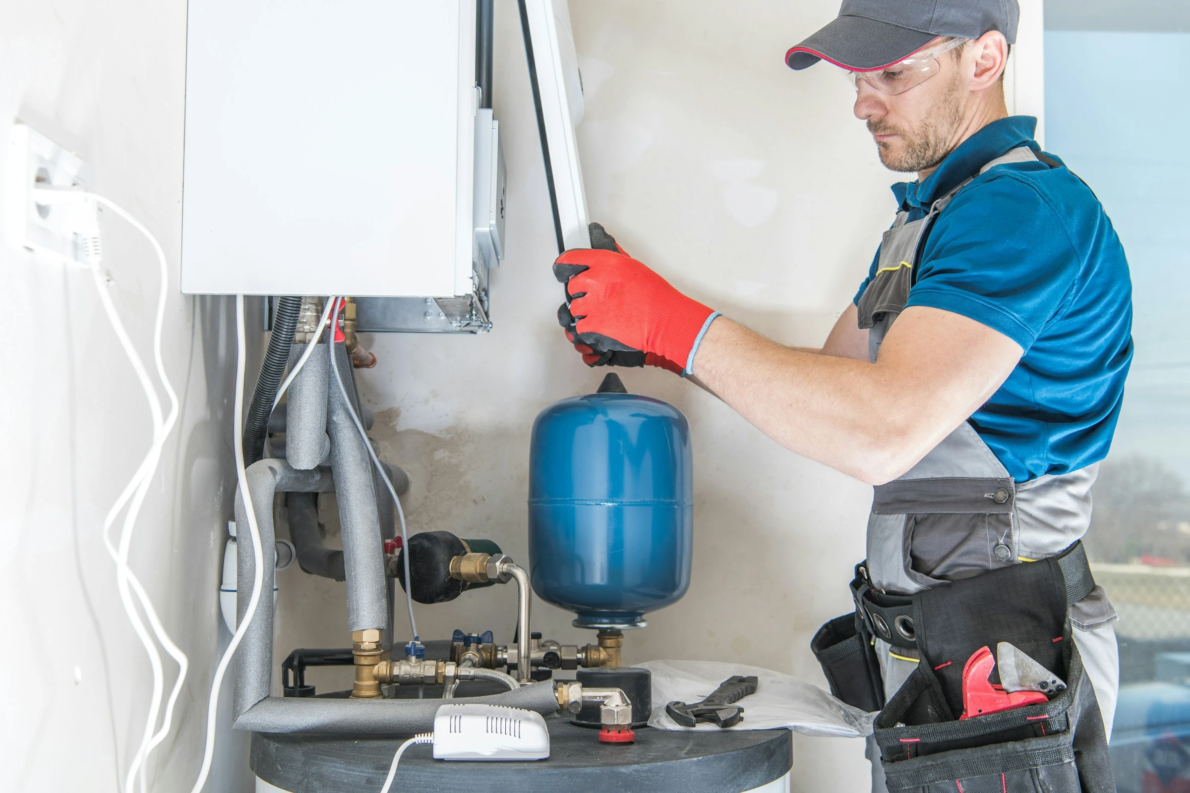Garrett Plumbing technician servicing a water heater